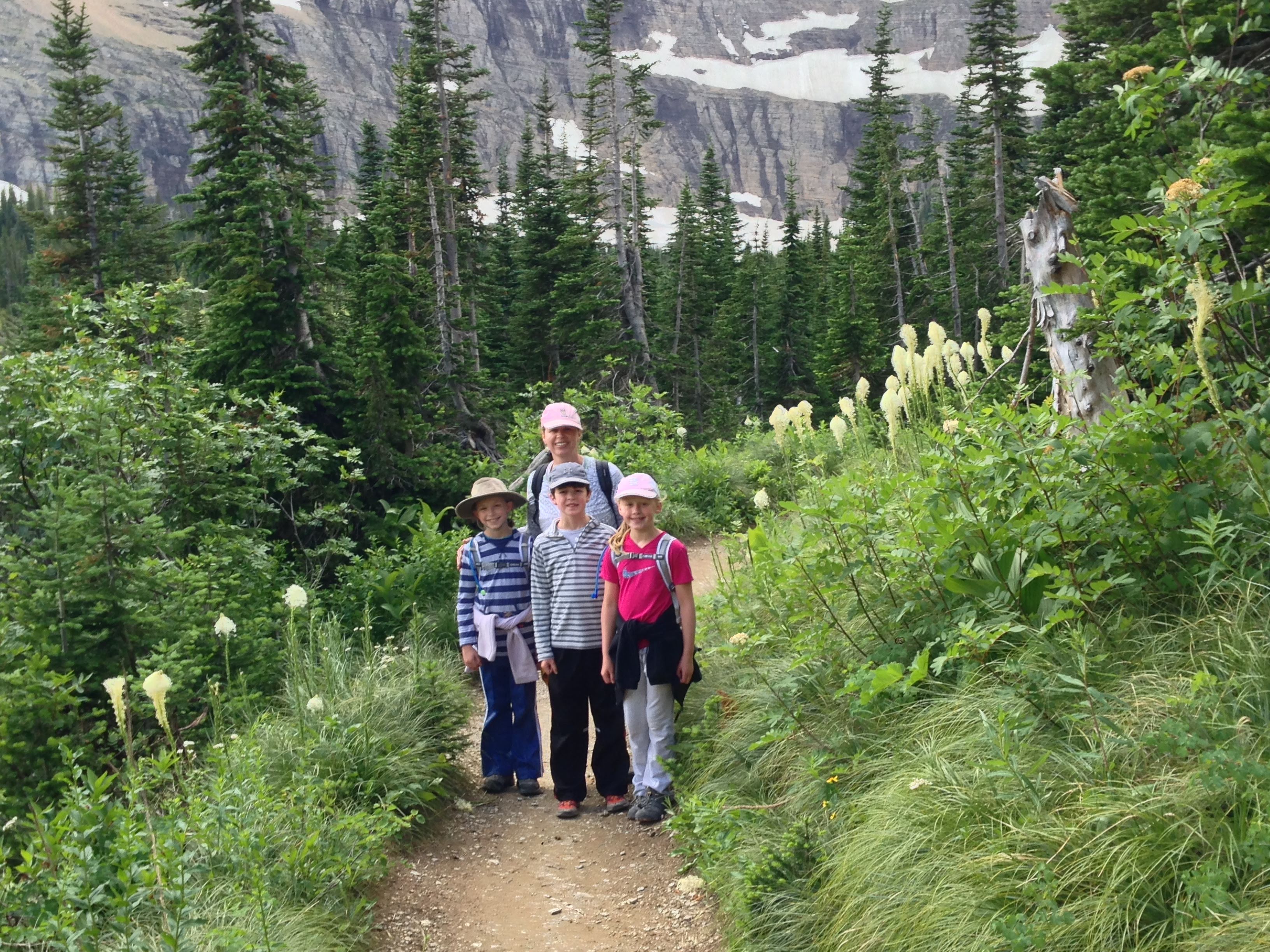 people standing on a hiking trail